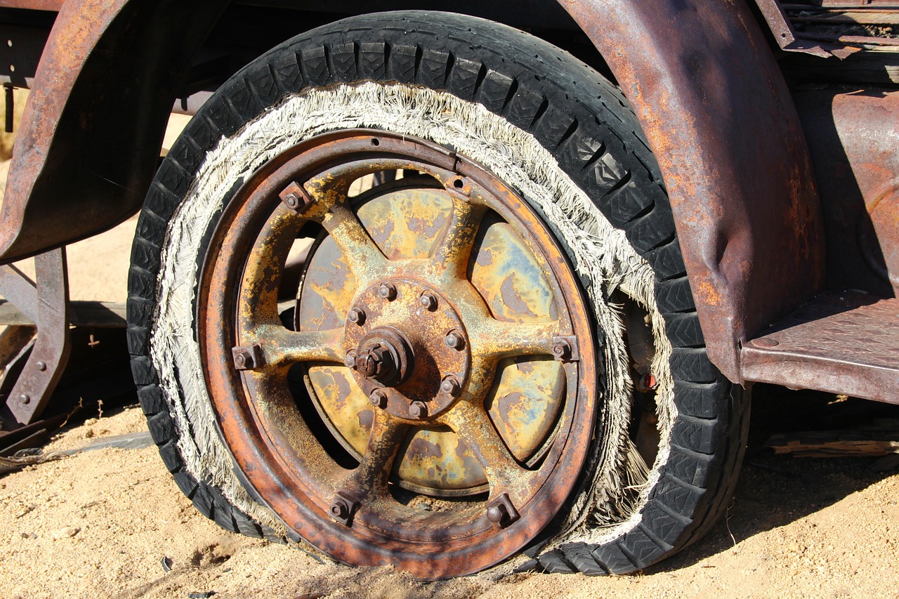 Shredded flat tire on an old truck