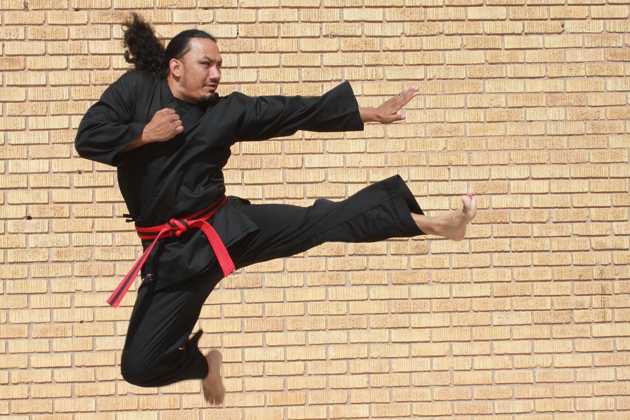 Karate fighter leaping kick