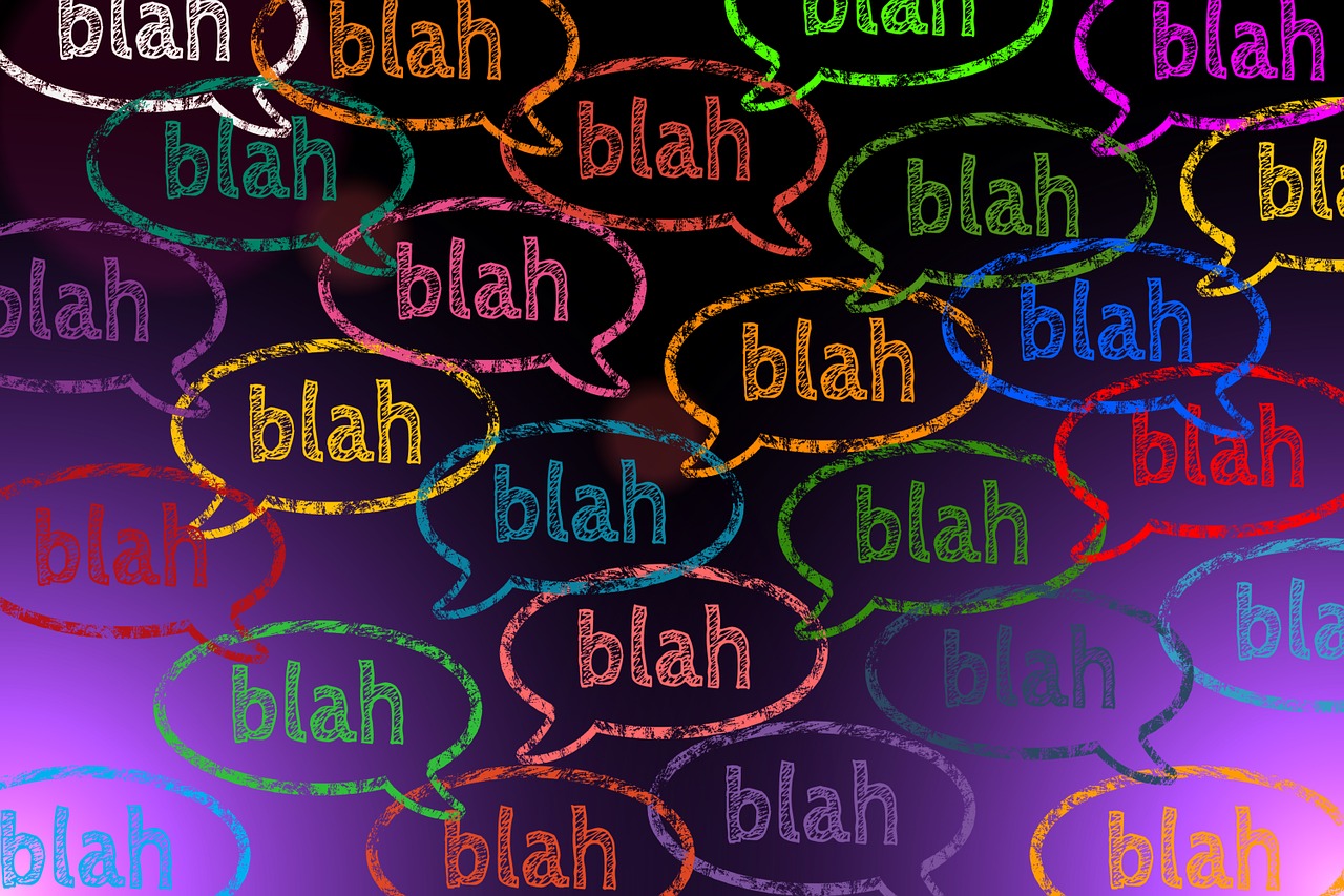 Word "blah" in multiple colors on a purple background
