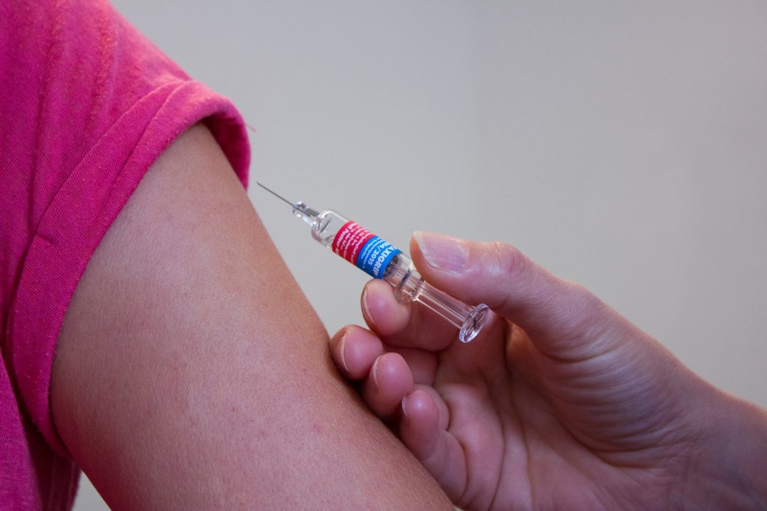 Person about to receive injection in arm