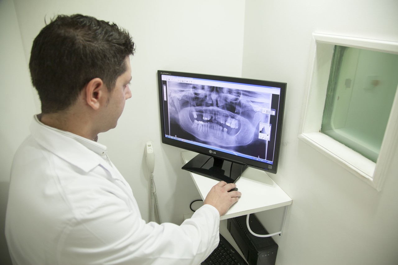 Physician looking at image on computer